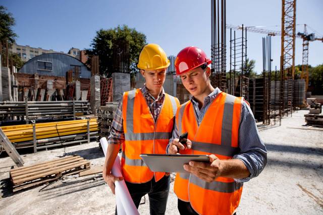 architect and structural engineer dressed in orang DJYCS8N 1